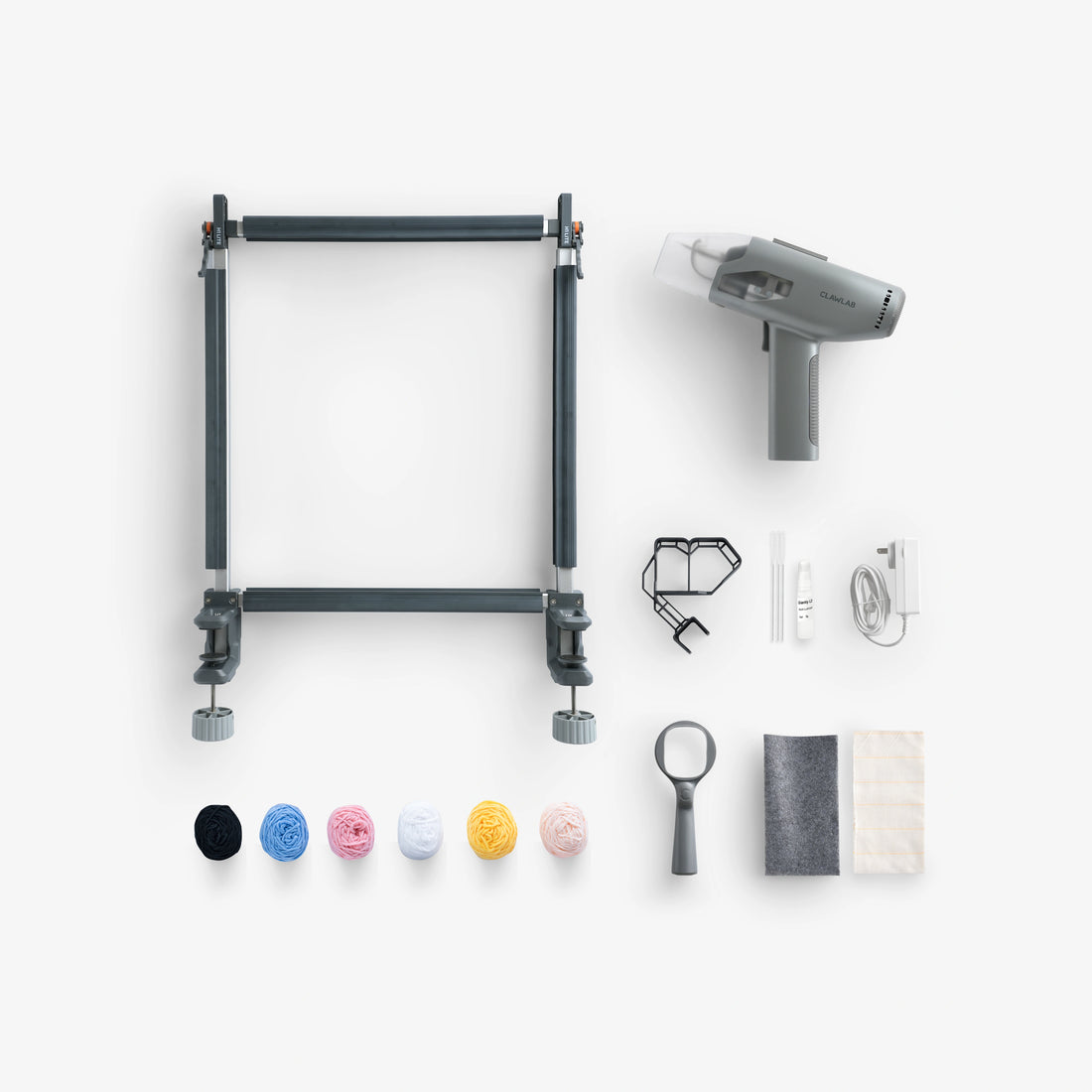 Clawlab Tufting Gun Kit H1 Lite flat lay with lightweight tufting gun, easy-clamp frame, yarn, fabric, and tools
