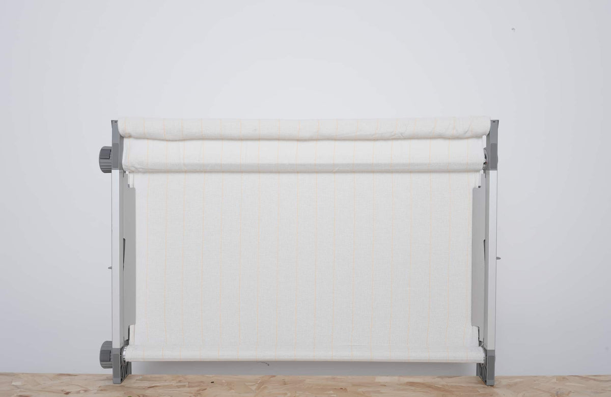 Clawlab H1 tufting frame with taut white striped fabric, designed for steady support.