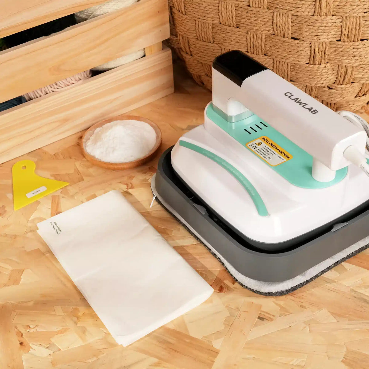 White and mint green Clawlab 8x10 heat press with TPU powder, silicone paper, scraper.