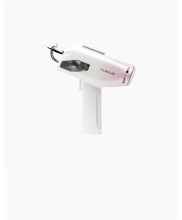 Angled view of the white Clawlab H1 tufting gun, showing its metal needle, side window and textured grip.